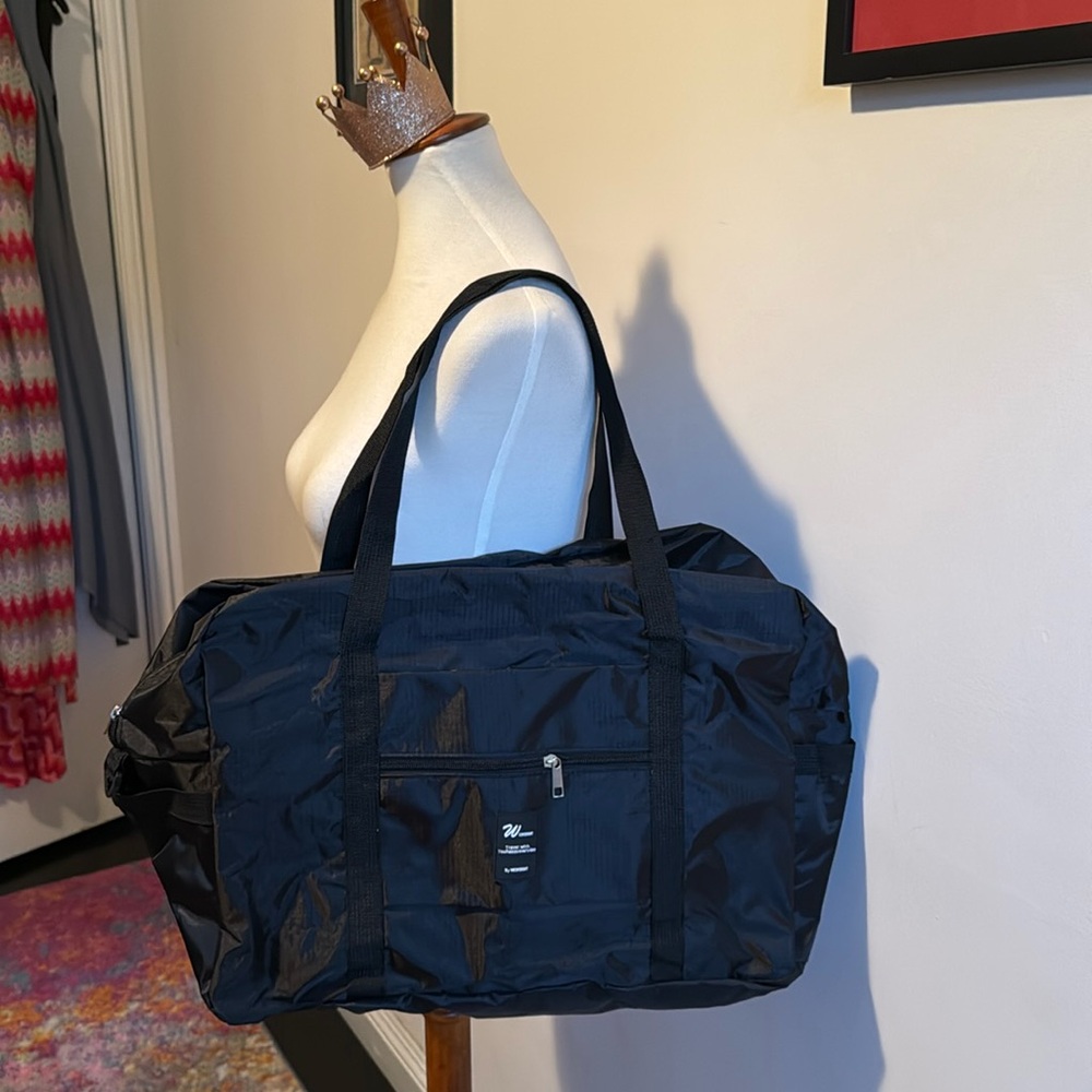 Black NWOT Trolly Sleeve  Duffle Bag